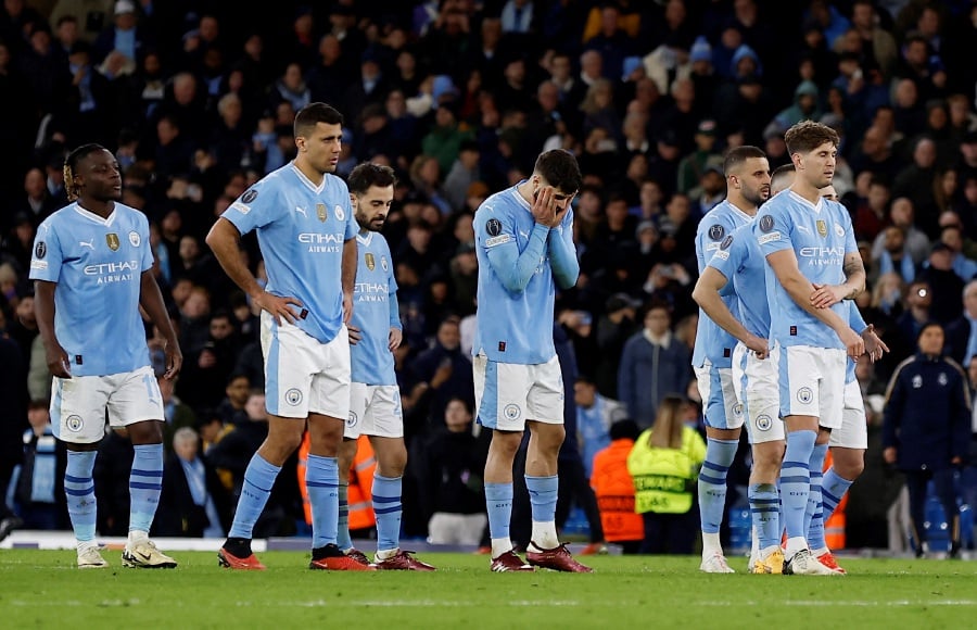 Manchester City's Bernardo Silva and teammates look dejected after the match. - Reuters pic