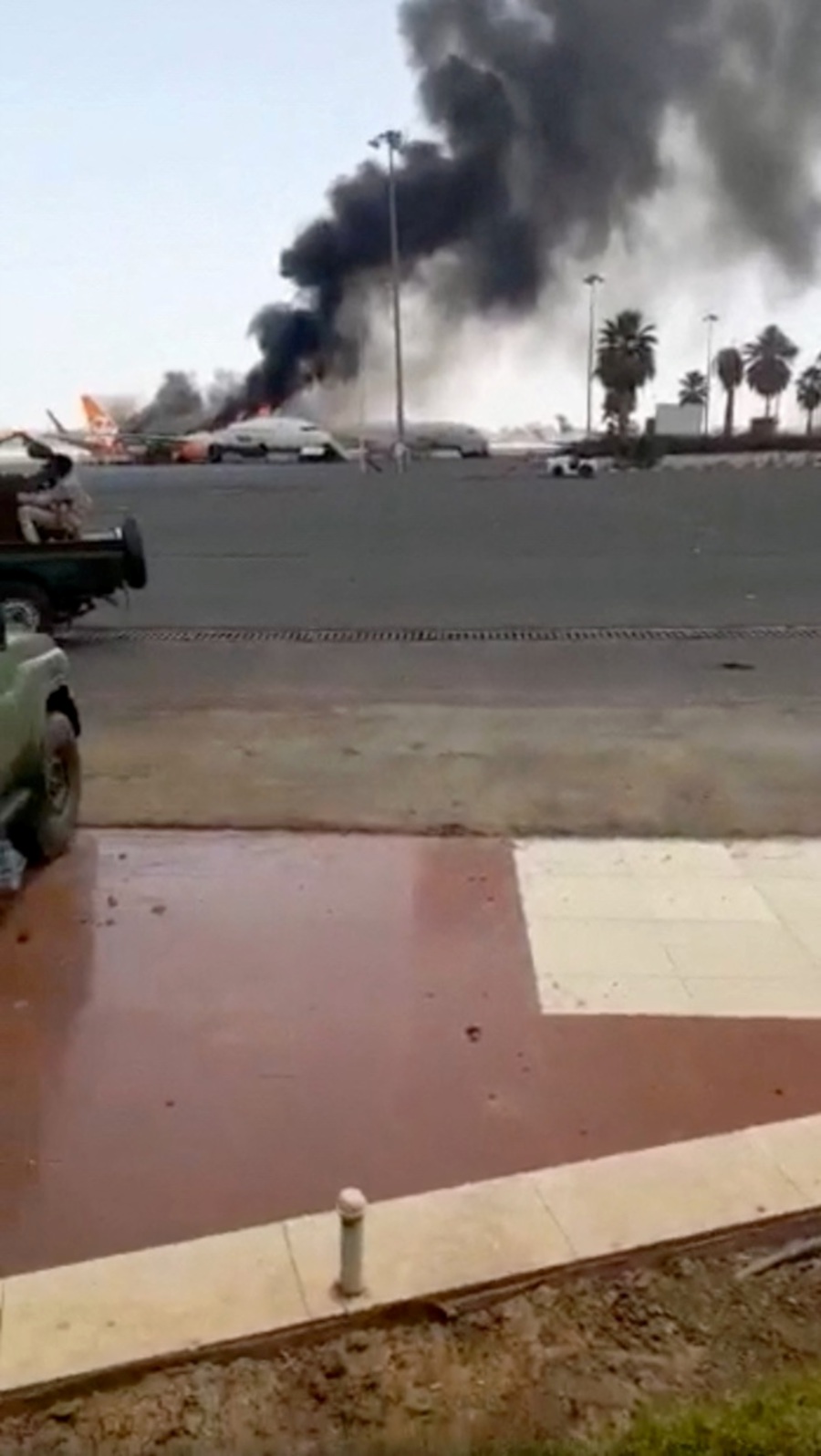 RSF soldiers are seen inside Khartoum airport as smoke billows from a burning plane, in Khartoum, Sudan, in this screen grab taken from a handout video released April 18, 2023.-REUTERS Pic