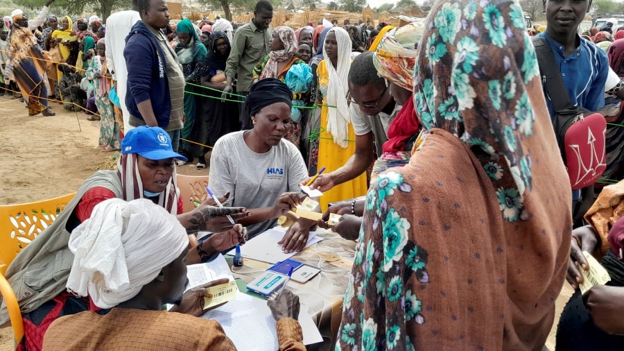 Sudanese refugees who have fled the violence in their country queue to receive food supplements from World Food Programme (WFP) near the border between Sudan and Chad in Adre, Chad April 26, 2023. - REUTERS Pic