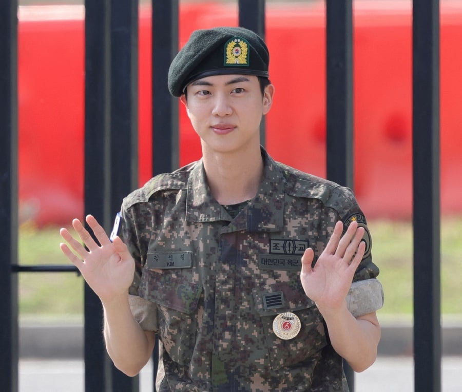 K-pop boy band BTS member Jin poses for photographs after being discharged from the military in Yeoncheon, South Korea, June 12, 2024. - REUTERS PIC
