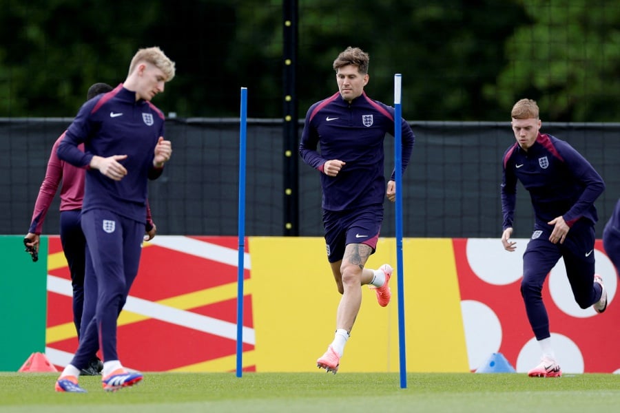 England's Cole Palmer, John Stones and Anthony Gordon during training. - REUTERS PIC