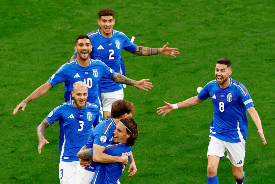 Italy's Nicolo Barella celebrates scoring their second goal with Riccardo Calafiori and teammates. - REUTERS PIC
