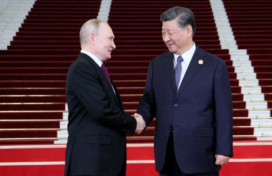 Russian President Vladimir Putin is welcomed by Chinese President Xi Jinping during a ceremony at the Belt and Road Forum in Beijing, China, October 17, 2023. - REUTERS Pic