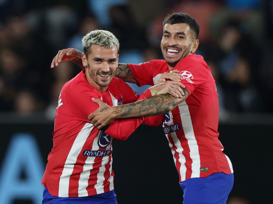 Atletico Madrid's Antoine Griezmann celebrates scoring their third goal with Angel Correa and completes his hat-trick. - REUTERS Pic