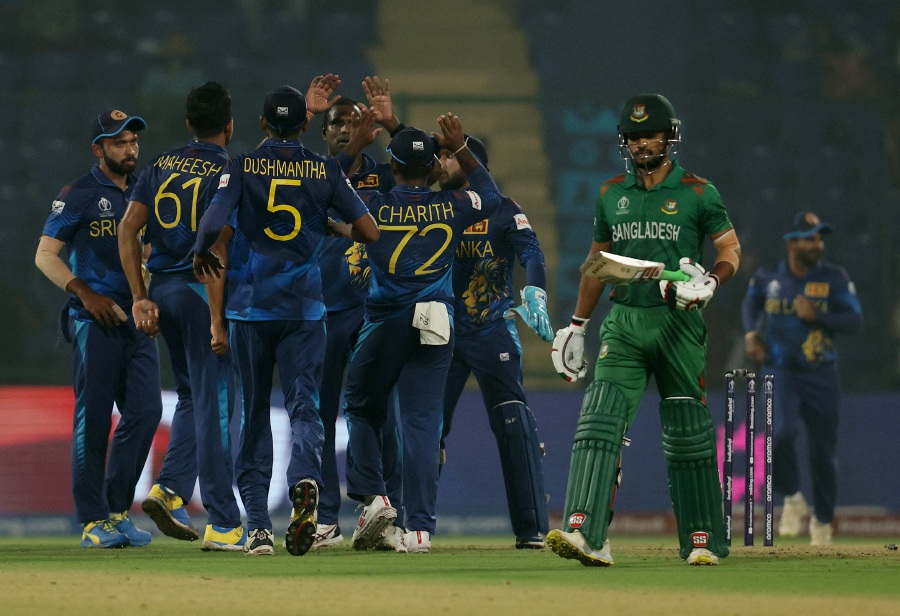 Sri Lanka's Angelo Mathews celebrates with teammates after taking the wicket of Bangladesh's Najmul Hossain Shanto. - REUTERS Pic
