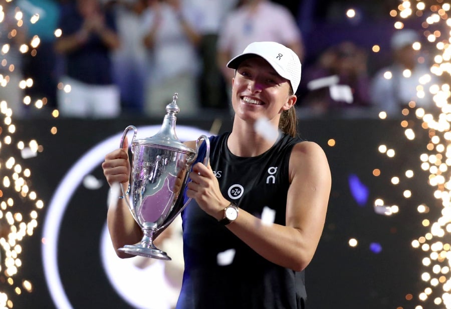 Poland's Iga Swiatek celebrates with the trophy after winning her final match against Jessica Pegula of the U.S. - REUTERS Pic