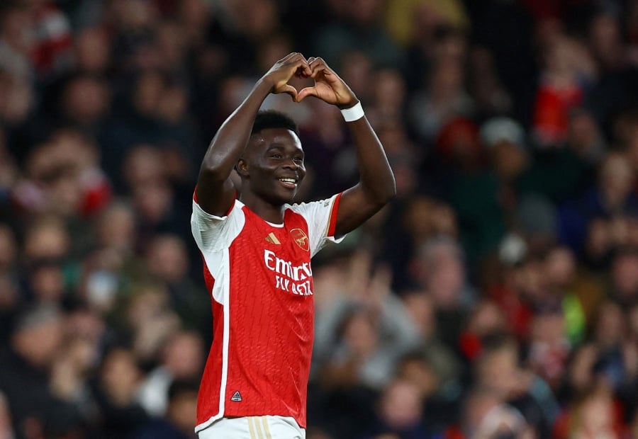 Arsenal's Bukayo Saka celebrates scoring their second goal. -REUTERS Pic