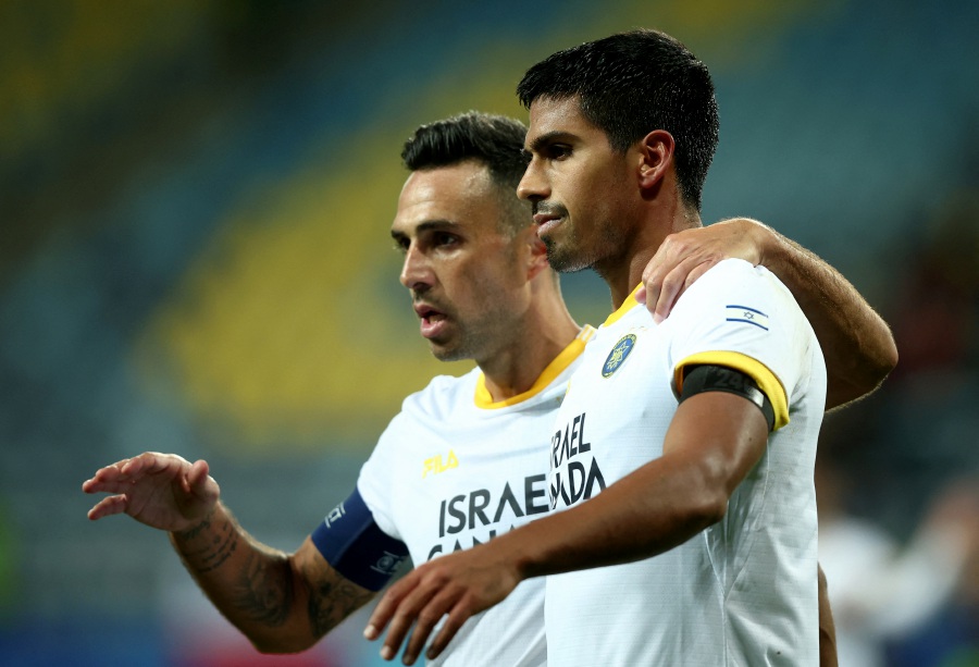 Maccabi Tel Aviv's Dor Peretz celebrates scoring their third goal with Eran Zahavi.- REUTERS Pic