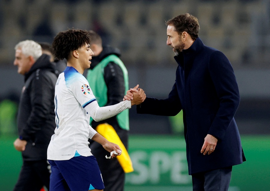 England manager Gareth Southgate shakes hands with Rico Lewis after the match. - Reuters Pic