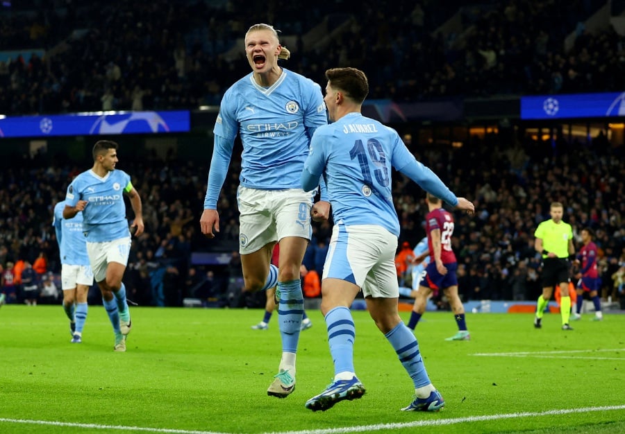 Manchester City's Julian Alvarez celebrates scoring their third goal with Erling Braut Haaland. - REUTERS Pic