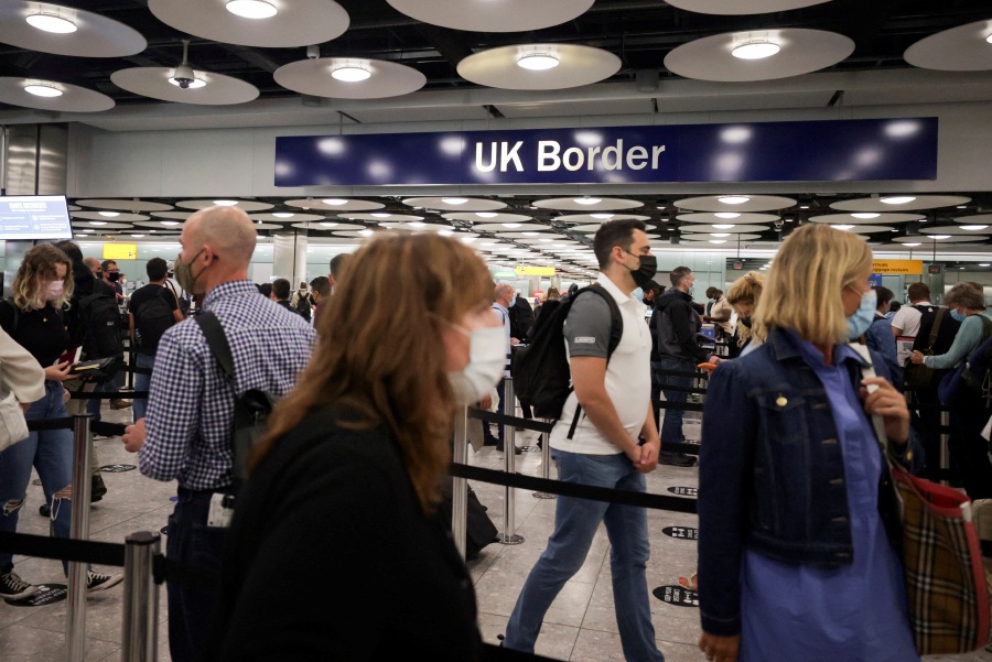 Arriving passengers queue at UK Border Control at the Terminal 5 at Heathrow Airport in London, Britain June 29, 2021. - REUTERS Pic