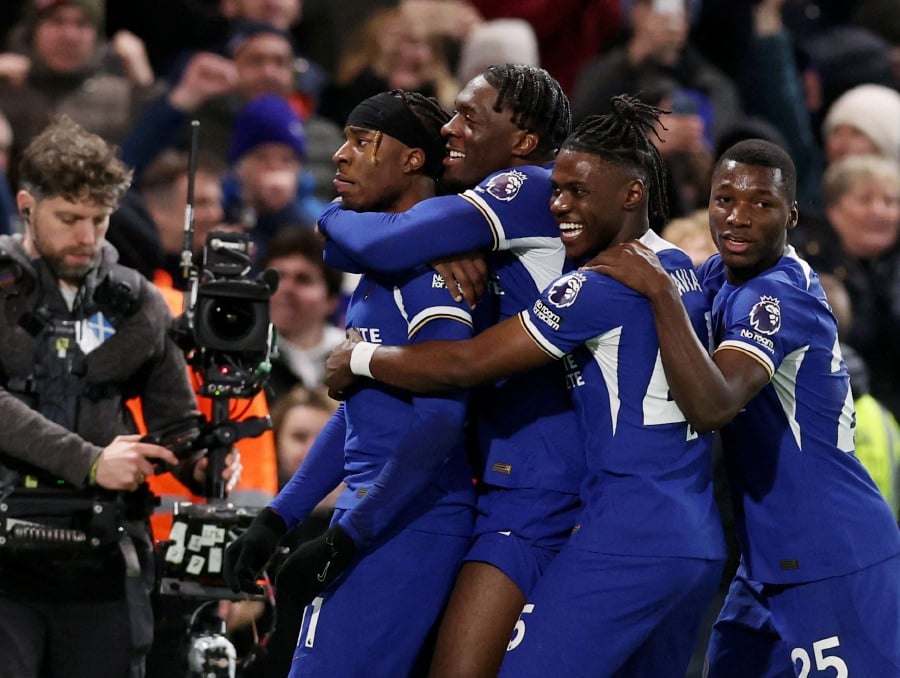 Chelsea's Noni Madueke celebrates scoring their second goal with teammates. - REUTERS pic
