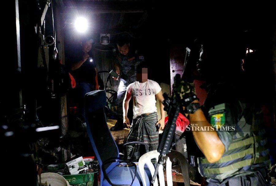 An illegal settlement for illegal migrants complete with a functioning convenience store and other amenities in Sentul was raided by the authorities early this morning. - NSTP/EIZAIRI SHAMSUDIN