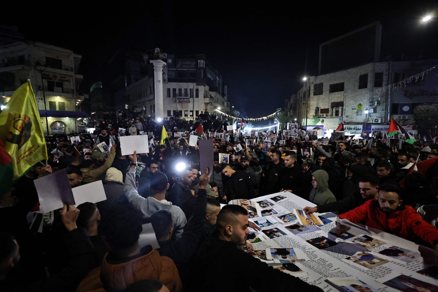Palestinians protest in solidarity with Gaza in Ramallah, in the occupied West Bank, on Jan 1, 2024. Israeli strikes pounded Gaza on Dec 31 as both sides neared the end of a dark year and the Israeli prime minister warned the war will last for many months. - AFP pic