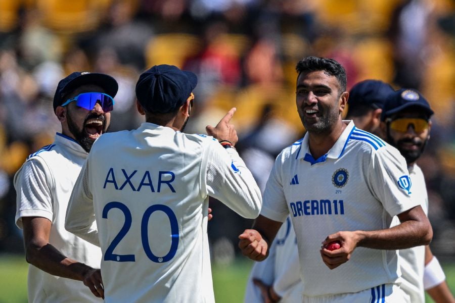 India's Ravichandran Ashwin (right) celebrates with teammates after taking the wicket of England's Ben Foakes during the third day of the fifth and last Test cricket match between India and England at the Himachal Pradesh Cricket Association Stadium in Dharamsala. - AFP pic