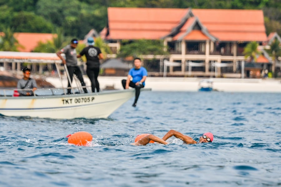 Melaka Straits Swim swimmers during their round island swim training in Redang Island.