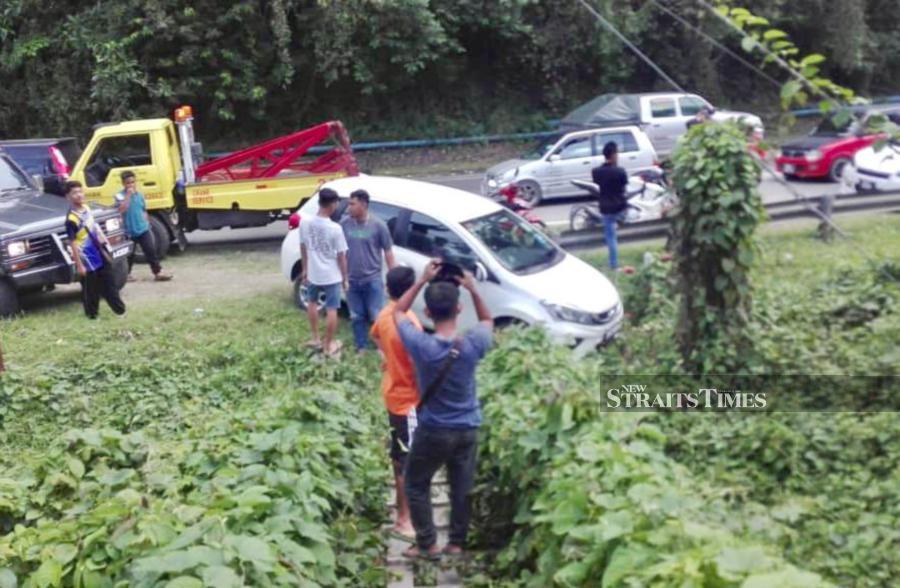 In the 12pm incident, two of the suspects attempted to escape in a car but failed when it skidded. - NSTP/ Courtesy of NST reader