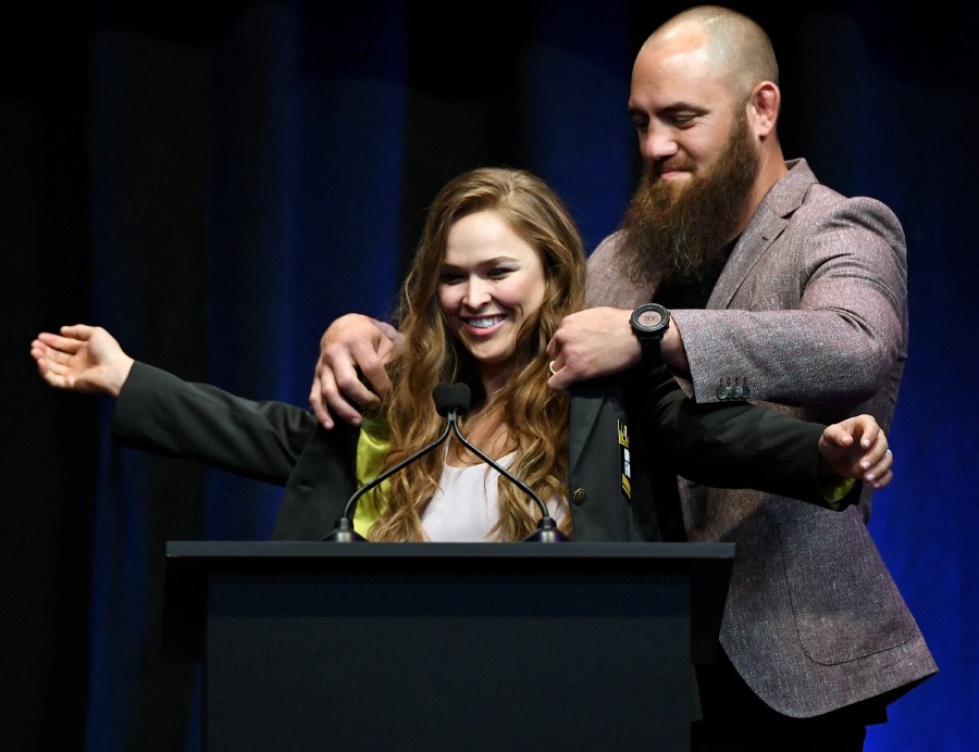  In this file photo taken on July 4, 2018 mixed martial artist Travis Browne (R) puts a UFC Hall of Fame jacket on his wife Ronda Rousey after she became the first female inducted into the UFC Hall of Fame at The Pearl concert theater at Palms Casino Resort in Las Vegas, Nevada. - AFP pic