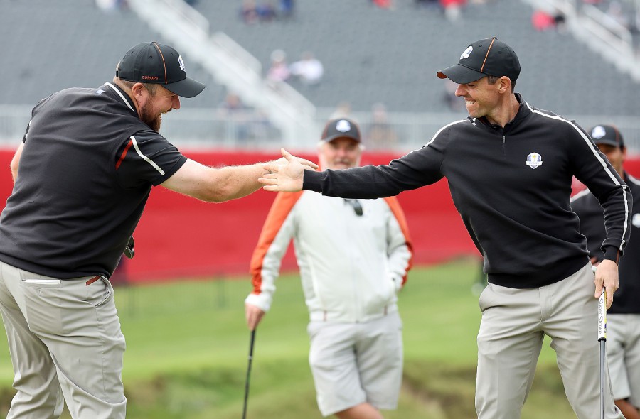 Shane Lowry of Ireland (L) and Rory McIlroy of Northern Ireland celebrate on the ninth green during practice rounds prior to the 43rd Ryder Cup at Whistling Straits in Kohler, Wisconsin. - AFP PIC