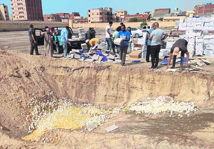 People disposing of rotten eggs, part of aid packages that had gone bad, amid the Palestine-Israel conflict in Rafah, Gaza, recently. REUTERS PIC