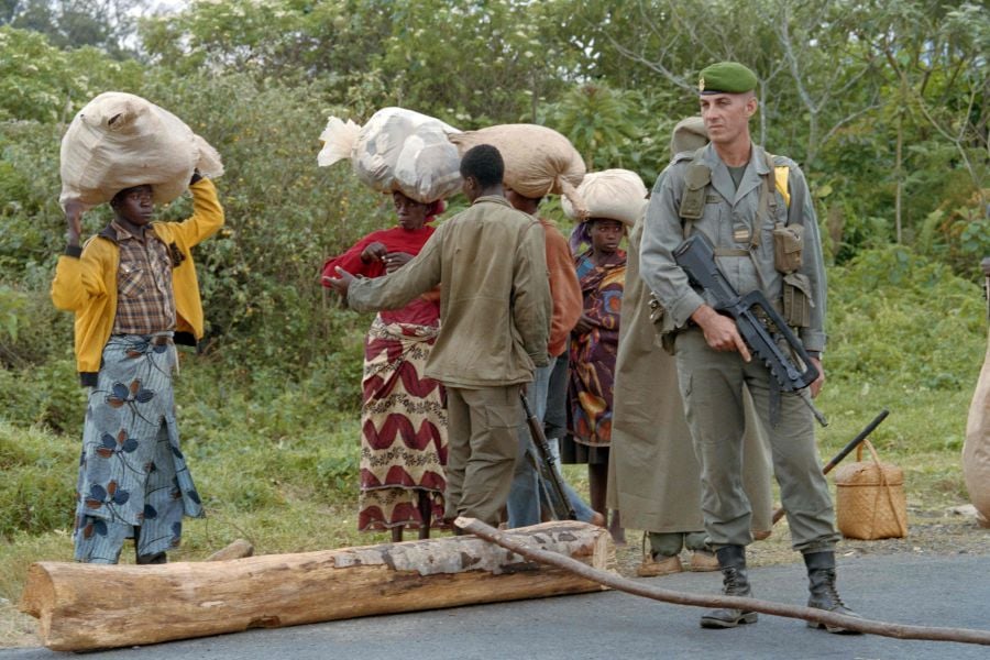 (FILES) A French legionnaire, participating in the French-led military Operation Turquoise, stands on July 07, 1994 at a Rwandan army barrage near the southwestern town of Gikongoro, the site of a French military camp, to protect Tutsi refugees from Butare, 28 kms west, seized by the rebels of the Rwandan patriotic Front (RPF) on July 04. The French-led military Operation Turquoise was launched on June 22, 1994 with the agreement of the UN Security Council.On April 6, 1994, the death of the Presidents of Burundi and Rwanda in a plane crash caused by a rocket attack, triggered several weeks of systematic and large-scale massacres targeting the Tutsi population and moderate Hutus in Rwanda. The number of murdered victims of the Rwandan genocide is about 800,000. - AFP pic