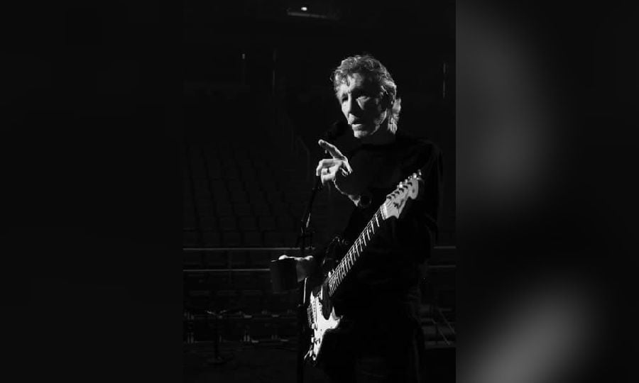 Pink Floyd co-founder Roger Waters was seen wearing a long, black coat with red armbands on stage at the Mercedes-Benz arena last week. - Pic credit Facebook rogerwaters