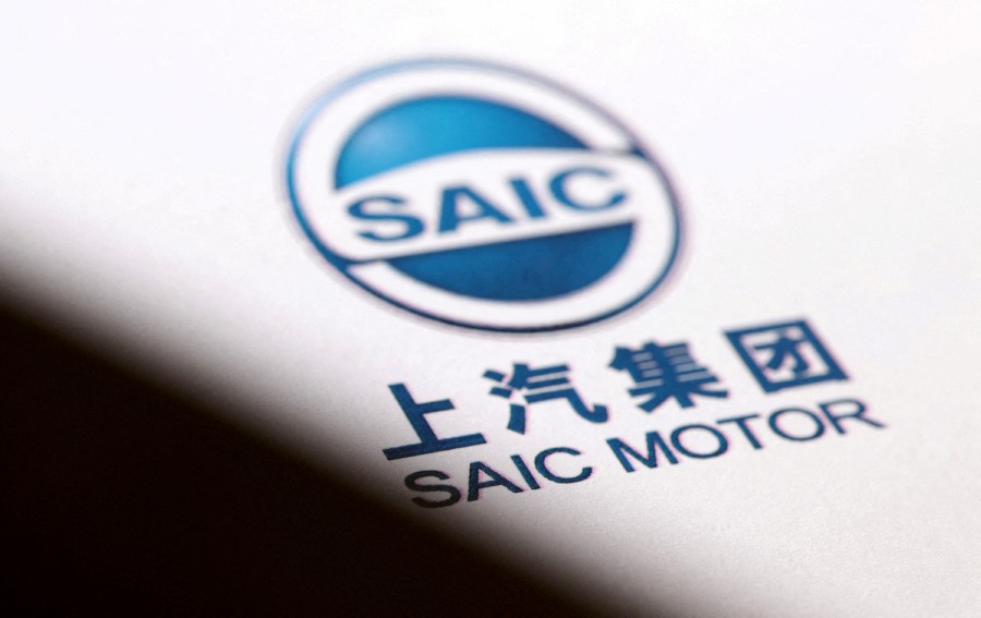 The state-owned automaker hopes to cut 30% of employees at SAIC-GM, 10% at SAIC Volkswagen and more than half at its Rising Auto EV subsidiary, the people said. -- Reuters photo