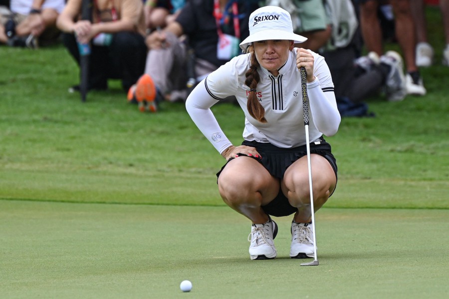 Hannah Green of Australia lines up for a putt during final round of the HSBC Women's World Championship golf tournament at Sentosa Golf Club in Singapore. - AFP pic