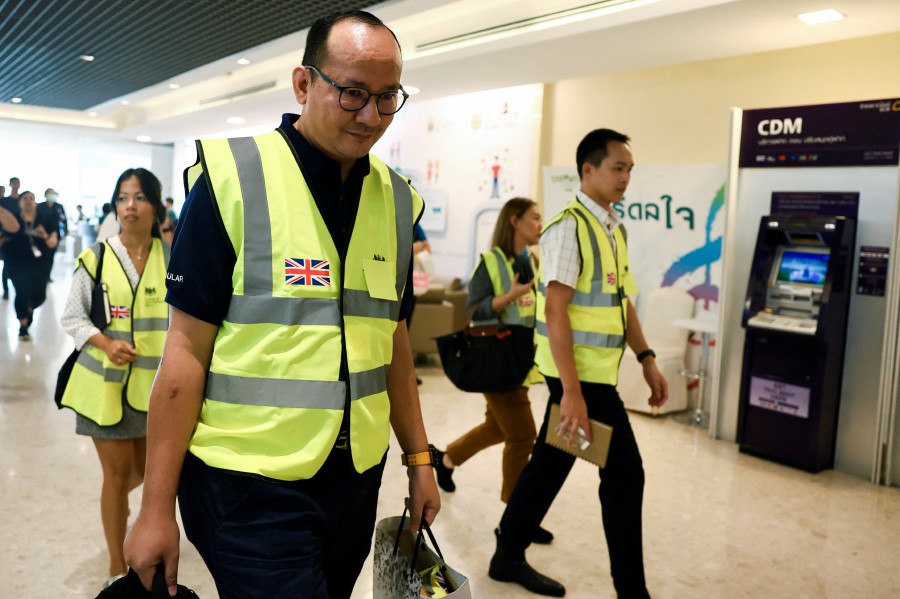 Representatives of the British embassy visit the Samitivej Hospital where injured passengers and crew of Singapore Airlines flight SQ321 were being treated following an emergency landing, in Bangkok Thailand, earlier today (May 22). — REUTERS