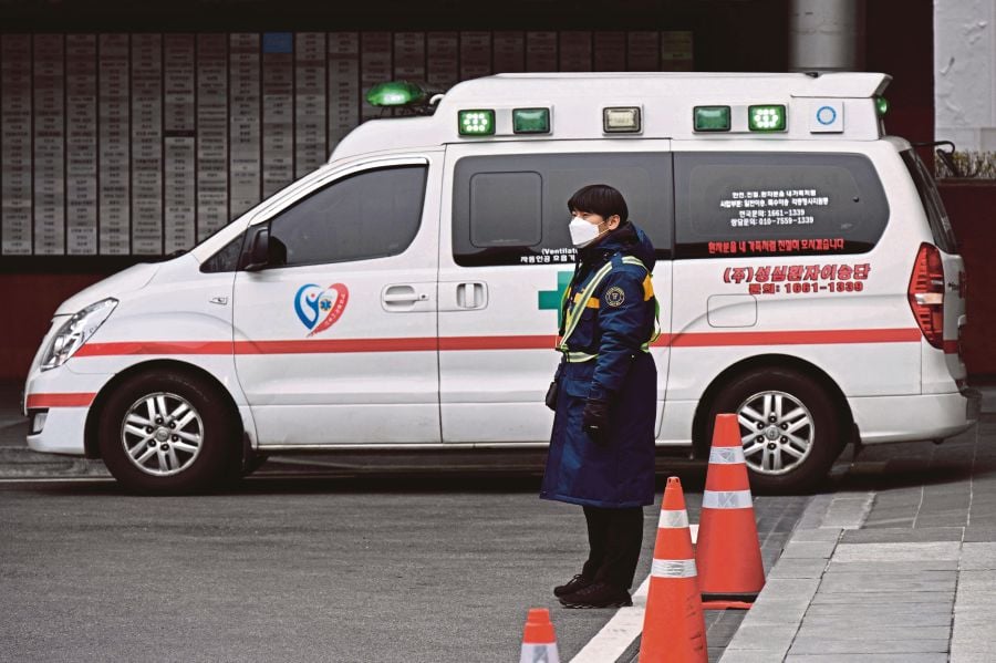 A recruit in training was transported to the military hospital in the nearby city of Daejeon in a state of cardiac arrest but was pronounced dead. (Photo by ANTHONY WALLACE / AFP)