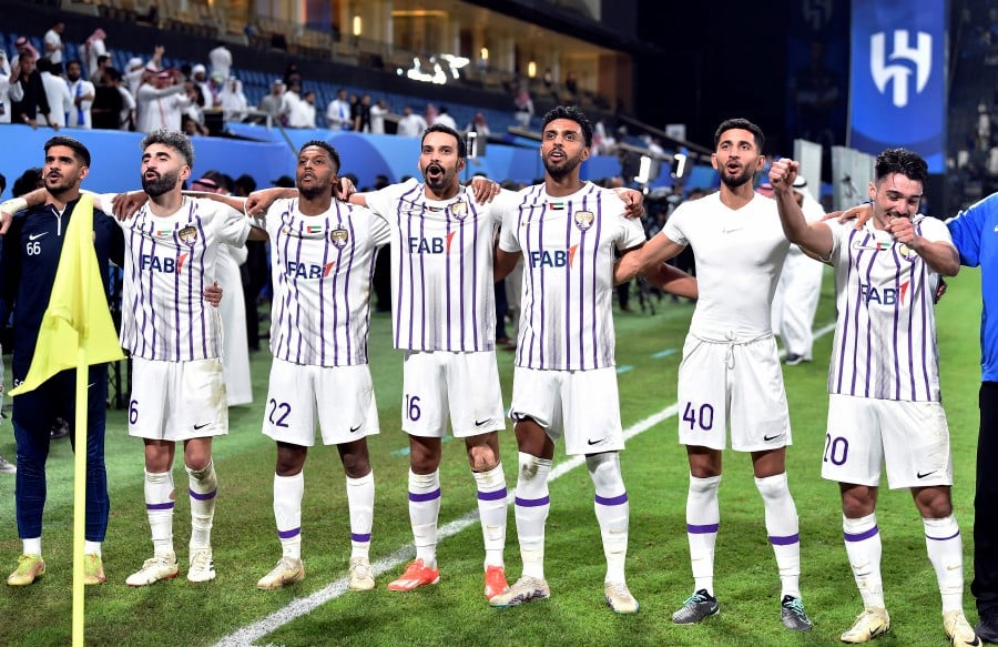 Al-Ain players celebrate after the match. REUTERS PIC
