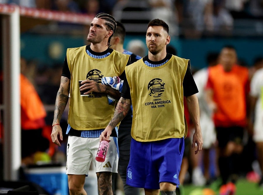 Argentina's Lionel Messi and Argentina's Rodrigo De Paul during halftime. REUTERS PIC