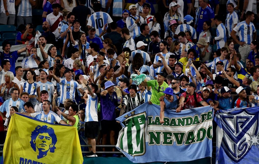 Argentina fans in the stands after the match. REUTERS PIC