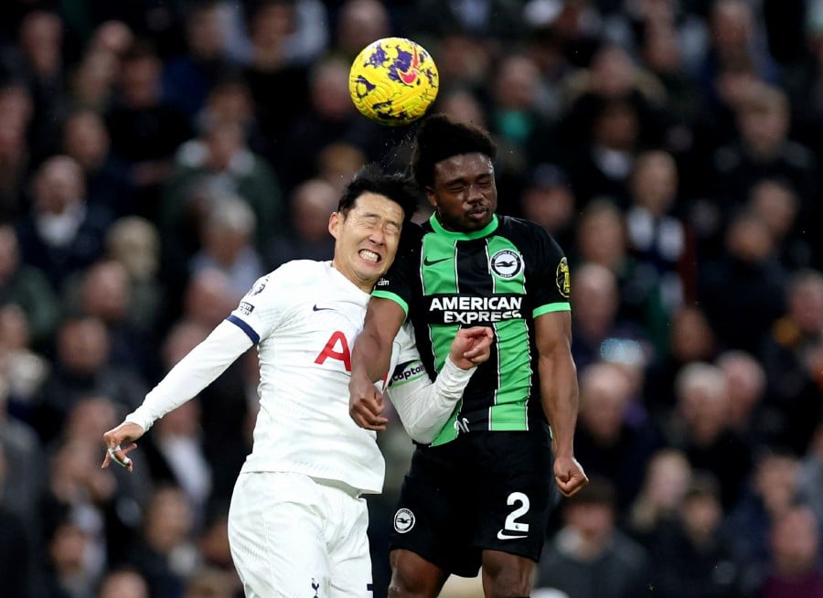 Tottenham Hotspur's Son Heung-min in action with Brighton & Hove Albion's Tariq Lamptey. REUTERS PIC