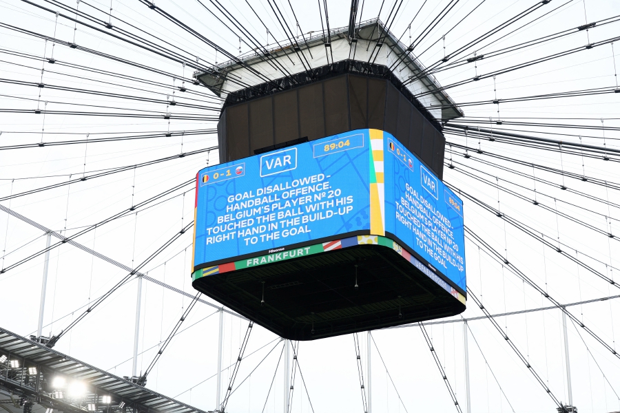 The big screen displays a VAR review message no goal for handball offense of Belgium's Lois Openda before Romelu Lukaku scores a goal. (REUTERS/Lee Smith)