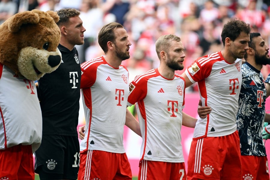 Bayern Munich's Harry Kane and teammates celebrate after the match. REUTERS PIC