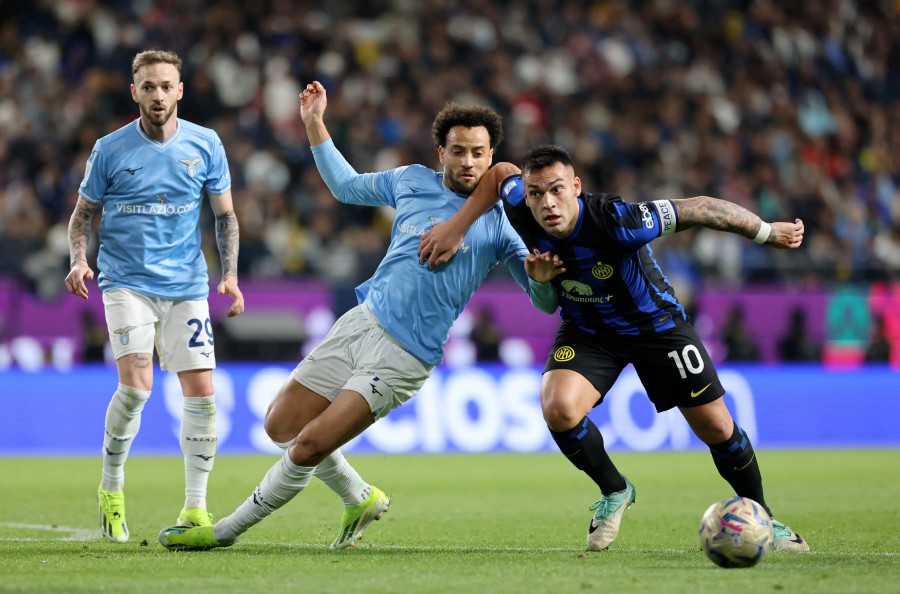 Inter Milan v Lazio - Al-Awwal Stadium, Riyadh, Saudi Arabia - Inter Milan's Lautaro Martinez in action with Lazio's Felipe Anderson. - Reuters pic