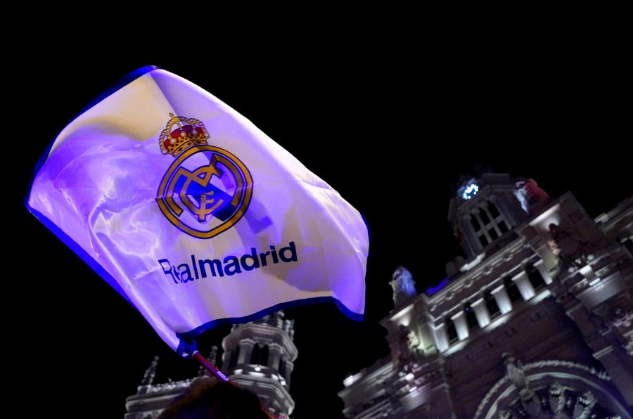 Real Madrid fans celebrate winning LaLiga in front of Madrid Town Hall. REUTERS PIC