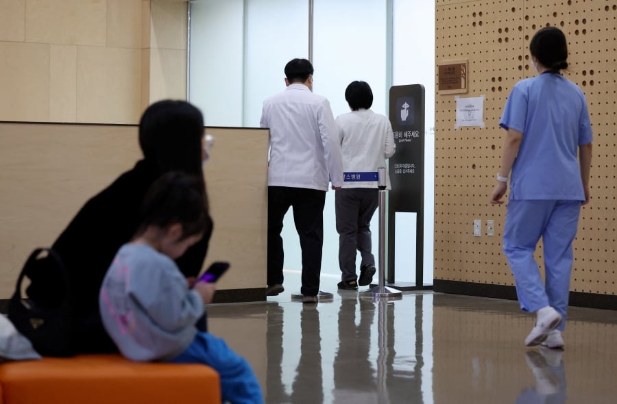 Medical workers walk at a hospital in Seoul, South Korea. (Yonhap via REUTERS)