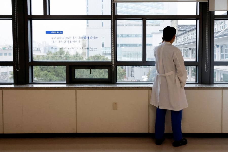 A medical worker uses a mobile phone at Severance Hospital in Seoul, South Korea. (REUTERS/Kim Soo-Hyeon)