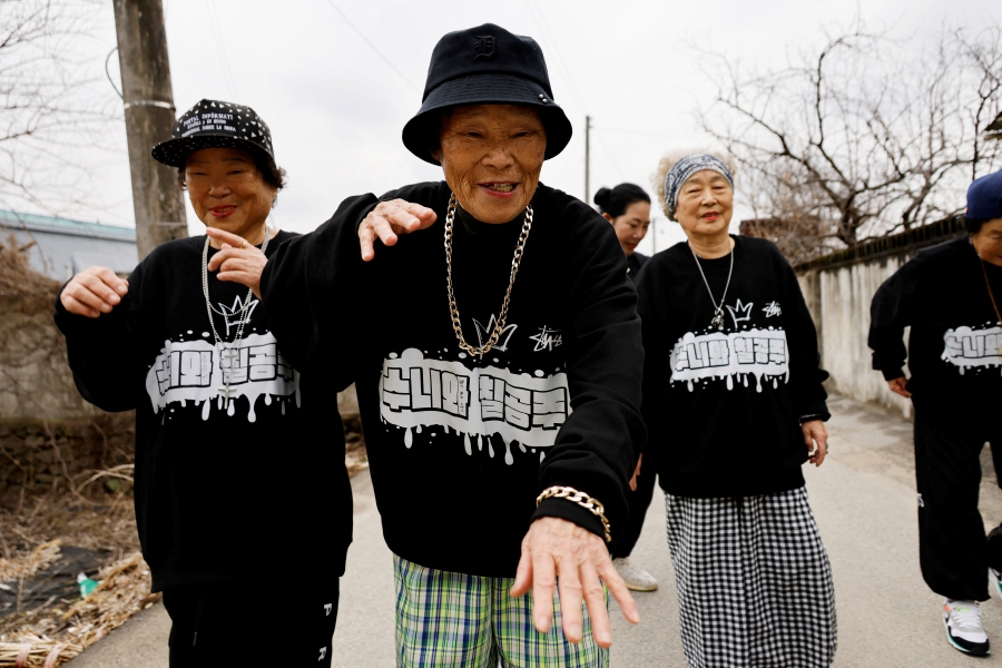Park Jeom-sun, 81, the leader of the granny rap group "Suni and Seven Princesses", along with members Hong Sun-yeon, 79, and Jeong Du-i, 90, raps on the street in Chilgok, South Korea. - REUTERS PIC