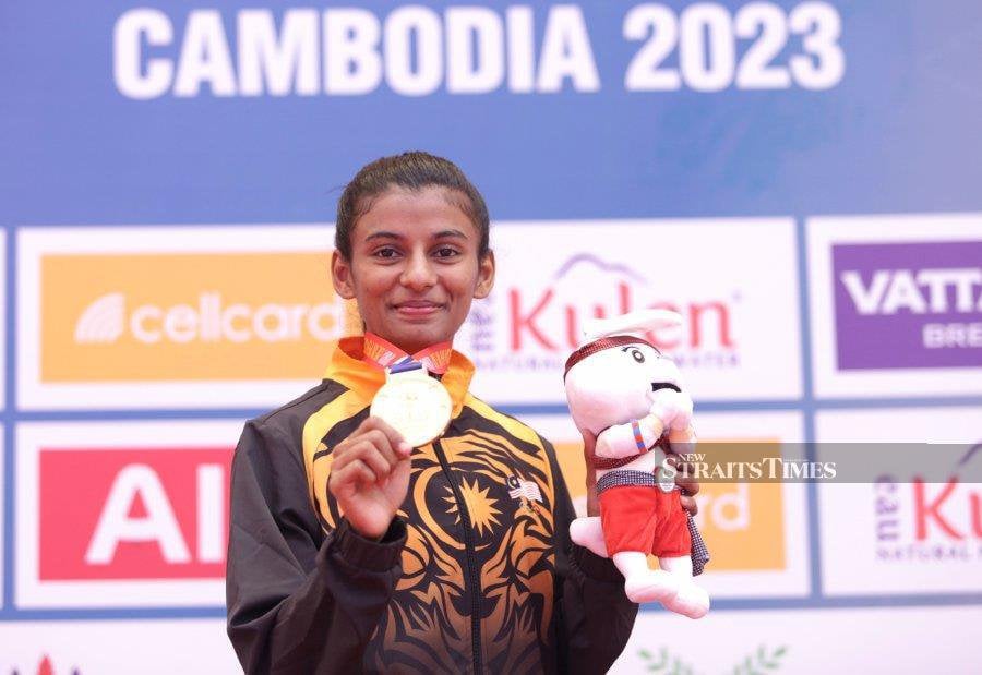 C. Shamalarani with her gold medal after defeating the Filipino athlete, Junna Tsukii, in the women's Kumite karate event and giving the country its first gold medal in the SEA Games Cambodia 2023.-NSTP/MOHAMAD SHAHRIL BADRI SAALI