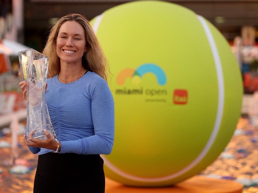 Danielle Collins of the United States poses with the trophy after winning the Women's Final at Hard Rock Stadium on March 30, 2024 in Miami Gardens, Florida. Collins defeated Elena Rybakina of Kazakhstan 7-5, 6-3. - (Photo by ELSA / GETTY IMAGES NORTH AMERICA / Getty Images via AFP)