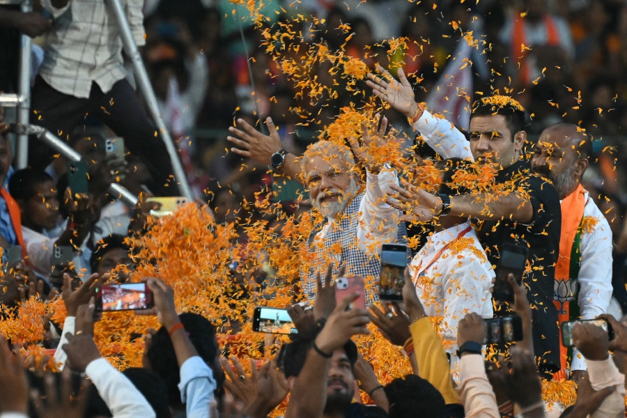 Indian Prime Minister Narendra Modi (C) waves to supporters as he arrives to attend a Bharatiya Janata Party (BJP) campaign meeting ahead of the Telangana state elections at Lal Bahadur Stadium in Hyderabad on Nov 7, 2023. AFP FILE PIC