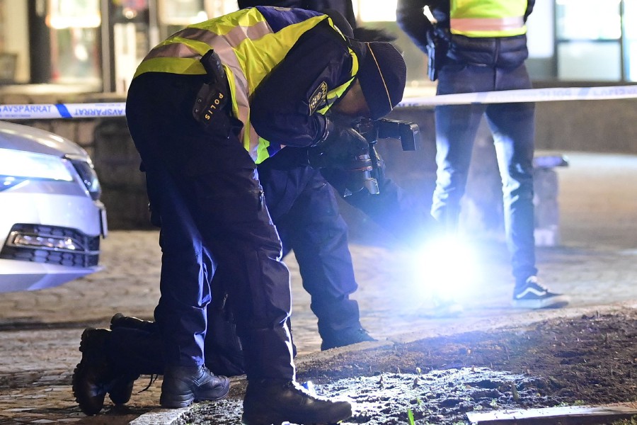 Police investigators work at the scene where a man attacked eight people with a "sharp weapon," seriously injuring two, in the Swedish city of Vetlanda  on March 3, 2021. - The assailant was taken to hospital after being shot in the leg by police when he was taken into custody, following the attack in the southern Swedish city in mid-afternoon. (Photo by Mikael FRITZON / various sources / AFP) 