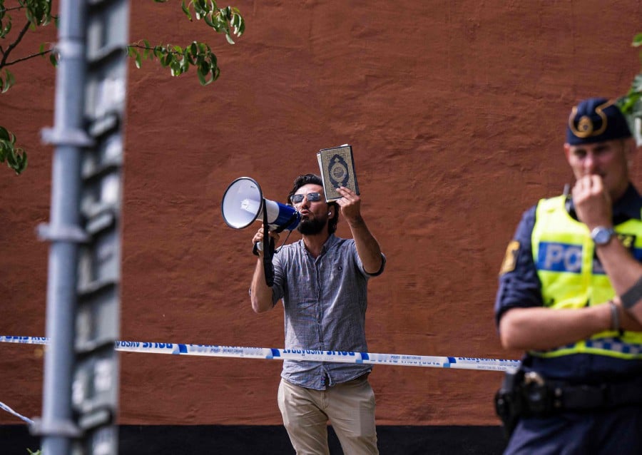 Salwan Momika protests outside a mosque in Stockholm on June 28, 2023, during the Eid al-Adha holiday. Momika, 37, who fled from Iraq to Sweden several years ago, was granted permission by the Swedish police to burn the Muslim holy book during the demonstration. -AFP file pic