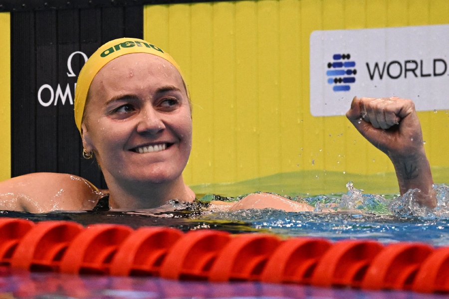 Australia's Ariarne Titmus reacts after winning and breaking the world record in the final of the women's 400m freestyle swimming event during the World Aquatics Championships in Fukuoka. (Photo by MANAN VATSYAYANA / AFP)