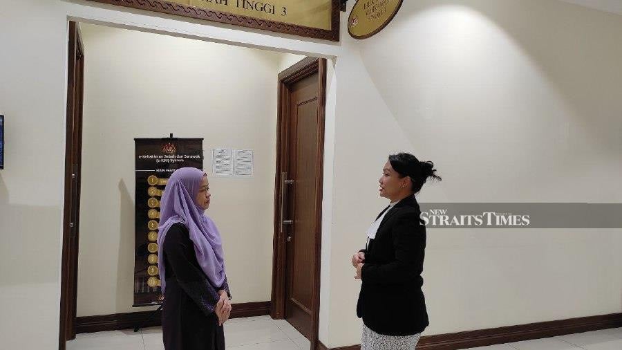Nurhaizah (left) talking to counsel Shireen Sikayun outside the courtroom. - NSTP/ERSIE ANJUMIN
