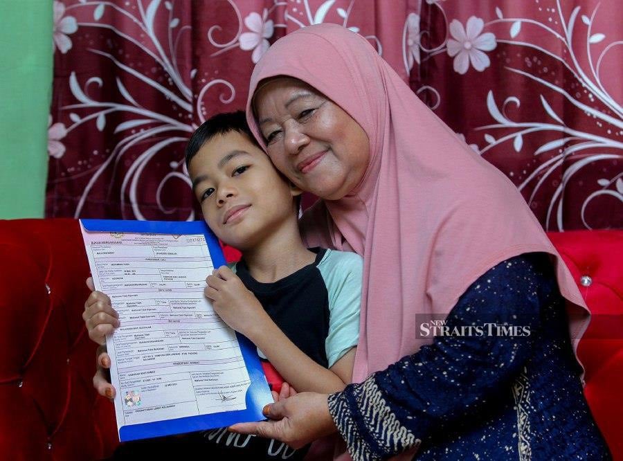 Sabariah Ahmad, 69, said her grandson, Muhammad Yusri, was an orphan from the marriage of her son Osman Jaafar with Wulandari Gustialam, who is an Indonesian citizen, but their marriage was not registered according to Malaysian law, making it difficult to register for a birth certificate. - NSTP/AZRUL EDHAM