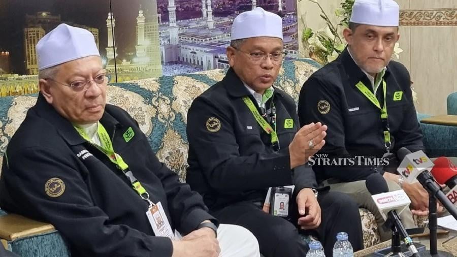 Minister in the Prime Minister’s Department (Religious Affairs) Datuk Dr Mohd Na’im Mokhtar (Center) offered his condolences to Zuraida Mohd Haris’s family, saying that management of the haj proxy would be borne by Tabung Haji’s charity fund. — PIC BY HUSAIN JAHIT